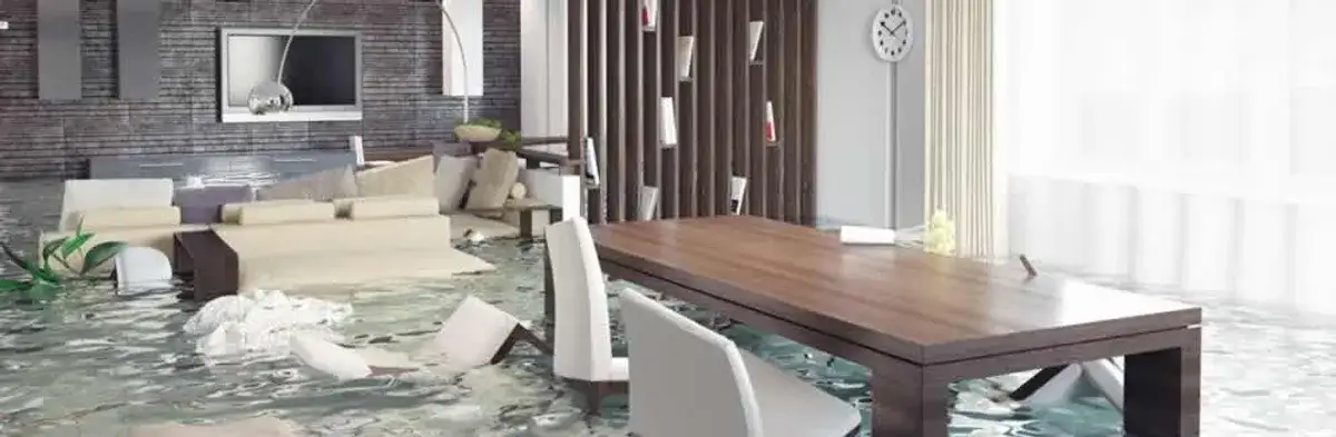 home interior affected by water damage with flooded floors and displaced furniture in San Antonio, TX